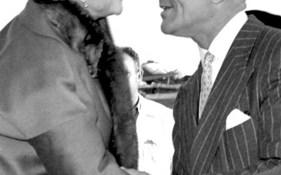 Helen Hayes is greeted by the U.S. Ambassador to Spain, John Davis Lodge.