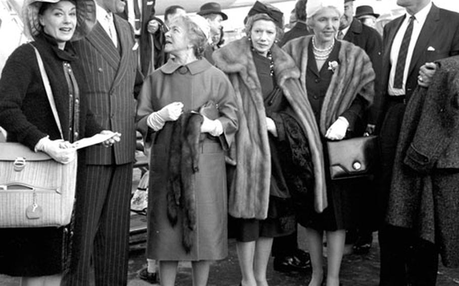 Posing at the airport are, left to right, actress June Havoc, Ambassador John Davis Lodge, actresses Helen Hayes and Helen Menken, Mrs. Lodge and actor Leif Erickson.