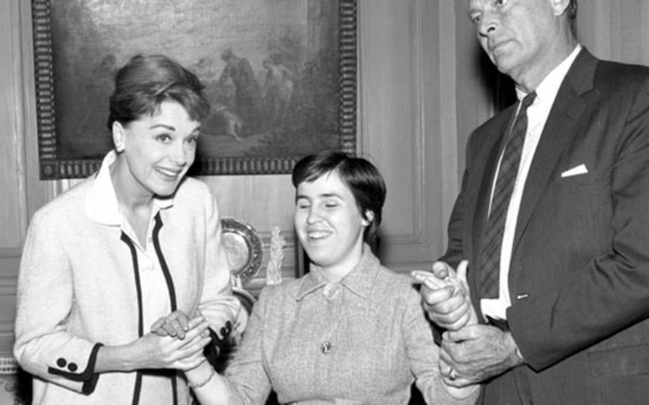 June Havoc and Leif Erickson hold the hands of a blind Spanish guest, 20-year-old Cerezo Maruga.
