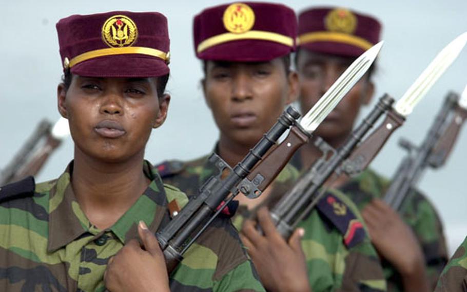 Members of the Djiboutian army&#39;s administrative corps stand at attention during the ceremony marking the donation of patrol boats Thursday morning.