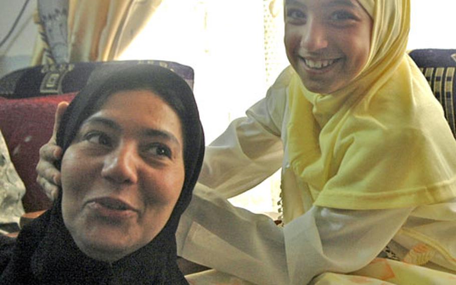Menar Abd Al-Matalab said she hopes, through her efforts on the Balad City Council, to create a better life for her daughter, 9-year-old Imana.