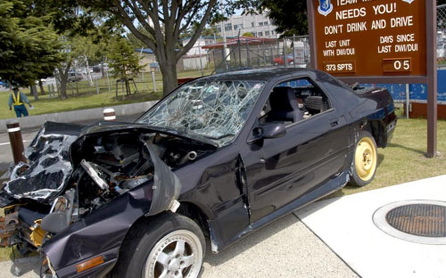A smashed-up car was placed in front of the “DUI Hitboard” near the main gate at Misawa Air Base, Japan, on Friday as a reminder of the potential consequences of drinking and driving.