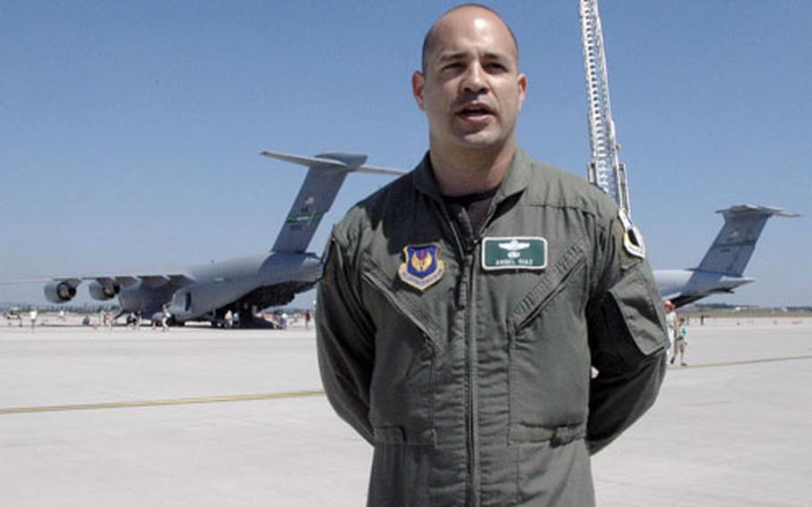 Lt. Col. Angel Diaz, 52nd Wing operations commander, stands in front of a C-5 and a C-17 plane, which were on display at Saturday’s open house at Spangdahlem.