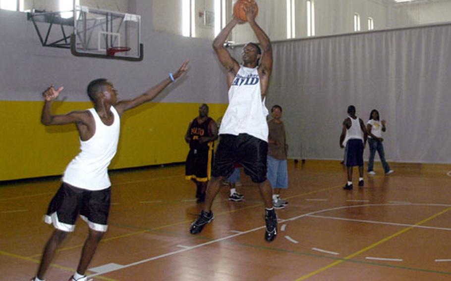 Teens shoot hoops on a recent Thursday afternoon at the base teen center on the Gricignano housing area in Naples, Italy.