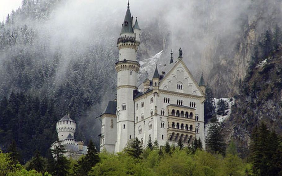 Neuschwanstein castle in the clouds in the Bavarian Alps, one of the sites Vicki Landes photographed for her book.