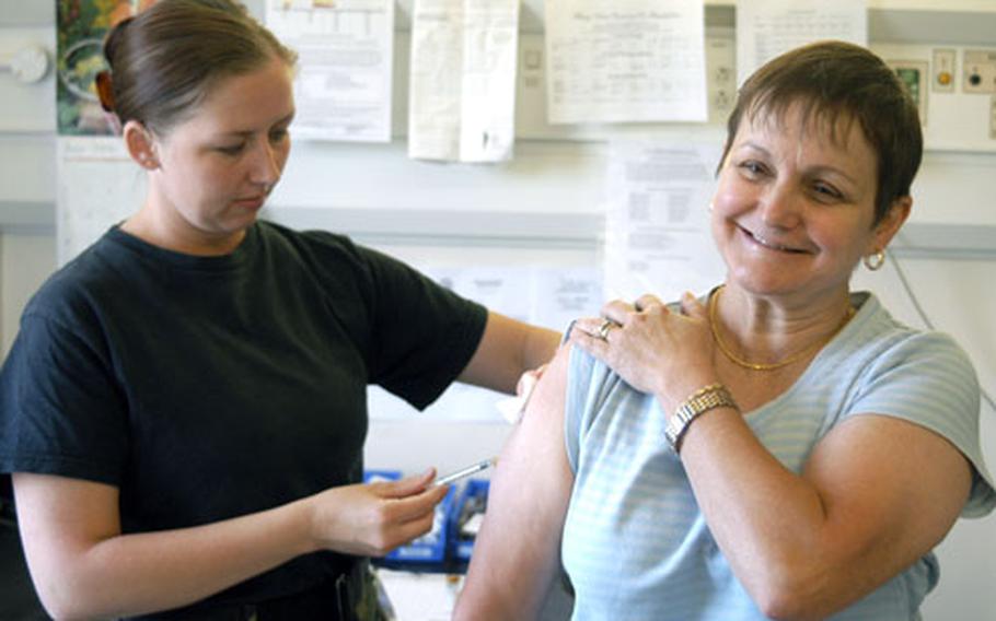 DODDS middle school teacher Catherine Golson gets an allergy shot from Staff Sgt. Sonya Patel at the RAF Lakenheath hospital. A dry spring and susceptibility to native U.K. grasses and trees have prompted a mini outbreak of allergies among Americans in the U.S. military community.