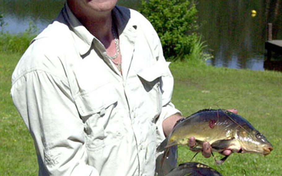 Steve Whittle, Joint Multinational Training Command deployable range package manager, caught a pair of large carp at the fishing contest.