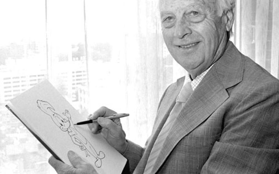 Walter Lantz sketches Woody Woodpecker.