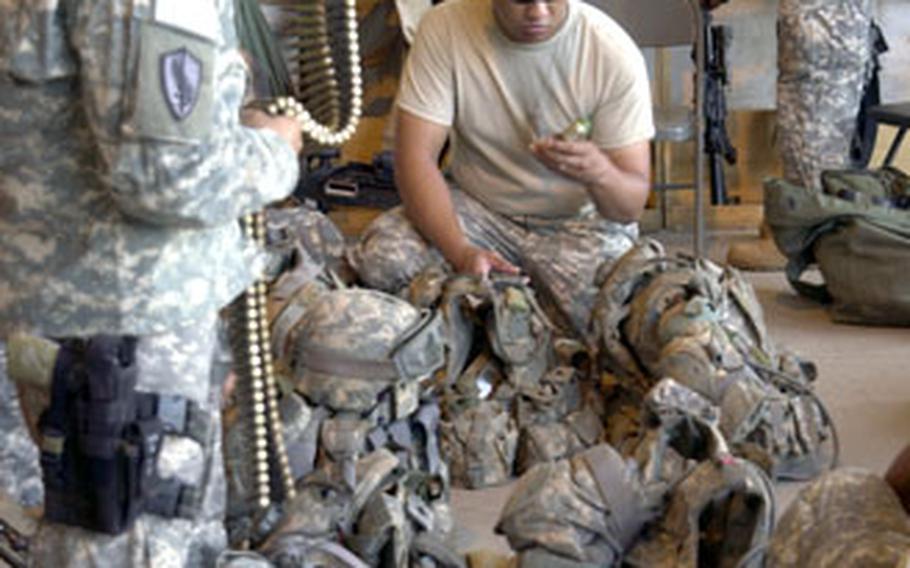 Soldiers from Company C, 1st Battalion, 294th Infantry Regiment, a Guam National Guard unit, load gear at Camp Lemonier last month before going to Djibouti.