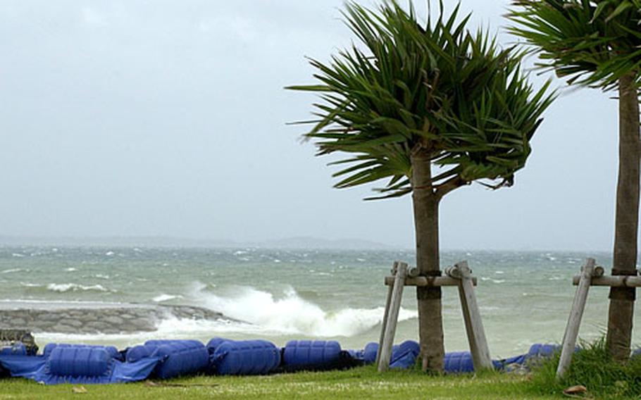 At Uken Beach near Camp Courtney, Okinawa, the surf crashed against the shore Saturday and the wind was blowing sand through the air hard enough to sting the skin.