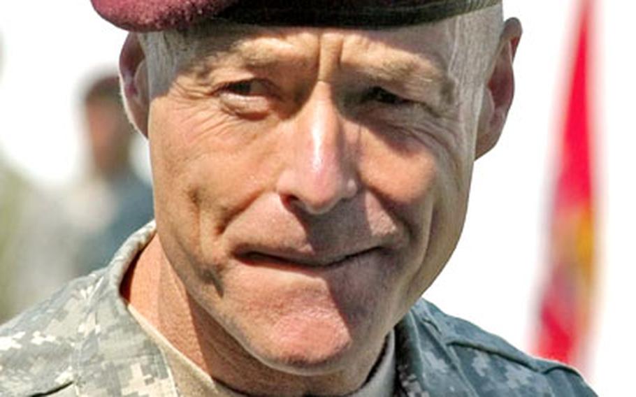 Maj. Gen. Frank Helmick, the new commander of the Southern European Task Force (Airborne), surveys the crowd before talking Monday at the change of command ceremony at Caserma Ederle in Vicenza, Italy.