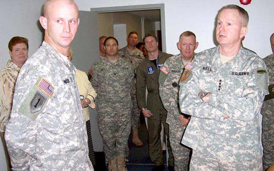 U.S. Forces Korea commander Gen. B.B. Bell talks to servicemembers while visiting Camp Red Cloud on Monday. When talking to servicemembers and civilians away from the command post, “it’s inevitable that we hear things that we haven’t heard in the past,” Bell said.