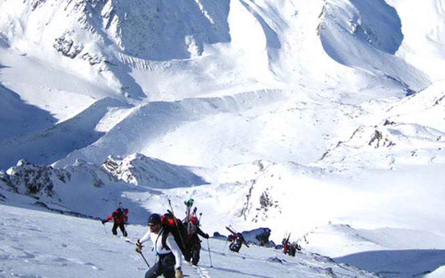 First Lt. Mark Uberuaga, foreground, from the 21st Special Operations Squadron, works his way up a mountainside on a training climb along the Haute Route hiking and skiing trail through the French and Swiss Alps last winter.