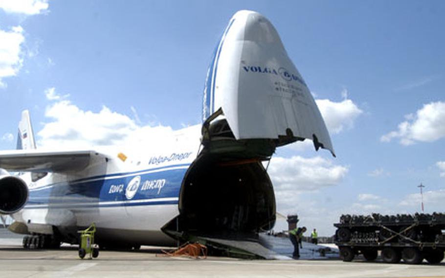 In this undated file photo, the crew of a Russian Antonov An124-100 aircraft load up a stack of trailers in support of the 492nd Fighter Squadron’s deployment to Bulgaria at RAF Lakenheath, England.