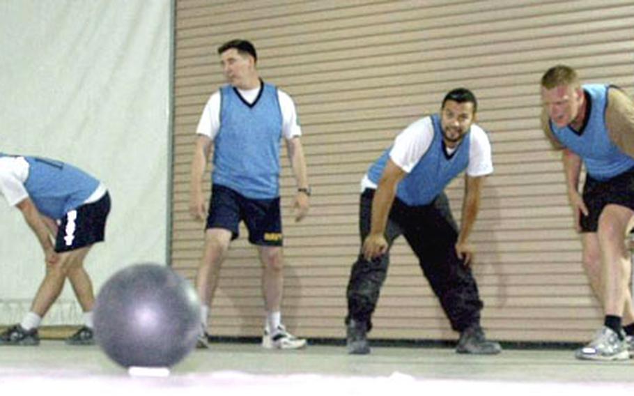Members of the C-J6 team ready for the start of another round of competition in Camp Eggers’ dodgeball league. The 12-team league has been a welcome distraction for troops at the Afghanistan base.