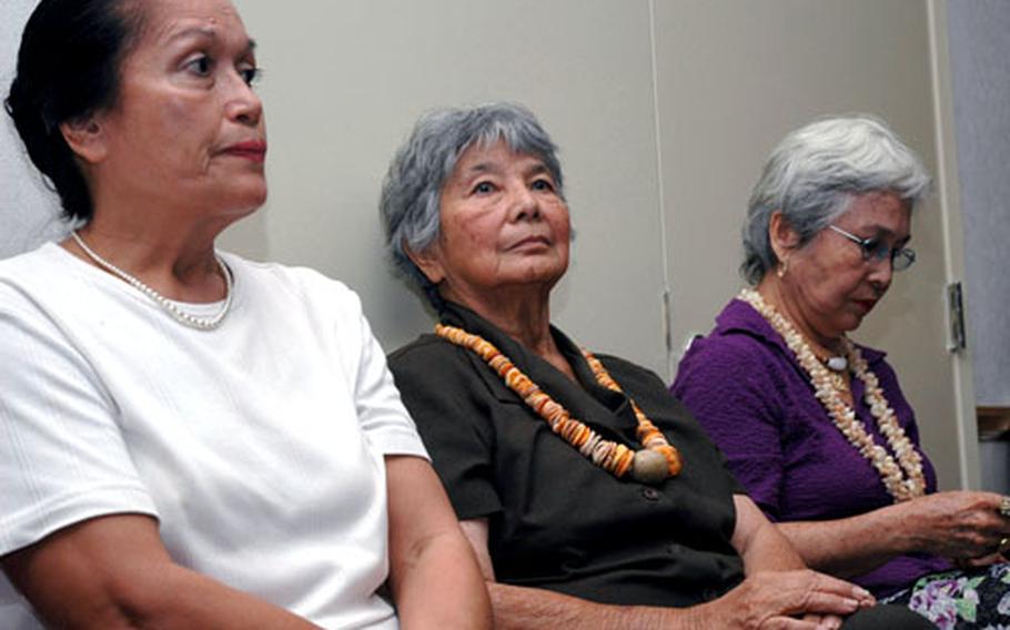 Guam residents Trini Torres, Rita Franquez and Bernice Wyttenbach-Santis listen last week to Pentagon and local officials talk about the pending military buildup on Guam.