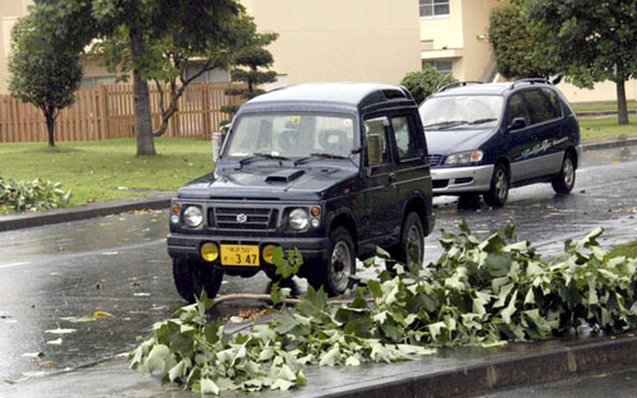 Streets were littered with littered with limbs, branches and leaves after a powerful thunderstorm tore through Yokota Air Base, Japan, on Saturday.