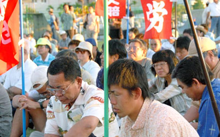 Peace activists listen intently to one of many speakers who denounced the possibility of Patriot missiles — and additional troops — coming to Okinawa.