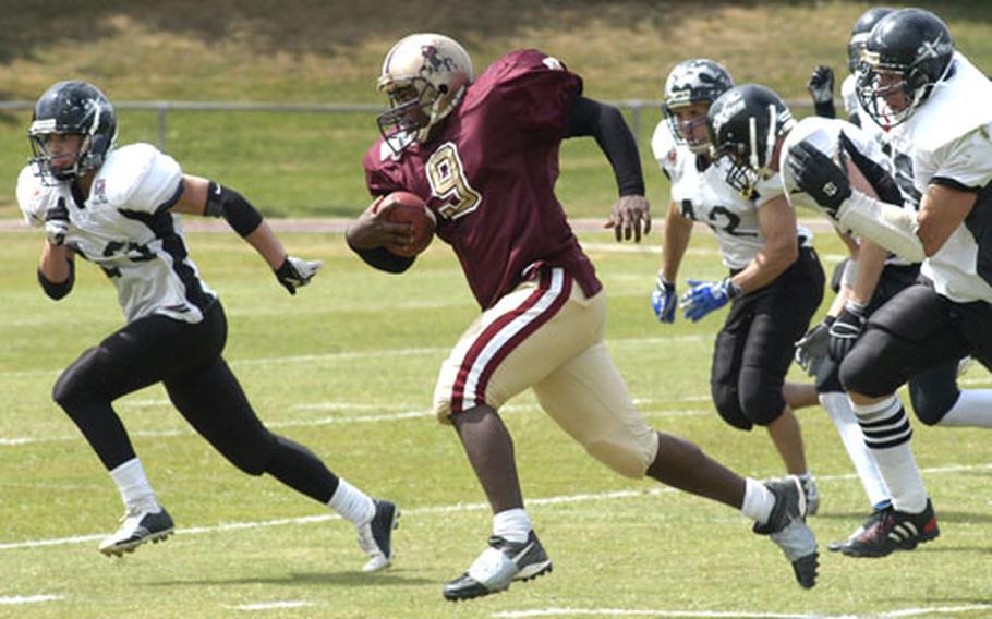 Senior Airman Jamaal Payne, an avionics technician for the 48th Aircraft Maintenance Squadron and a running back for the MCP Ipswich Cardinals, sprints toward the end zone on his way to a 29-yard touchdown run during a recent game against the Kent Exiles.
