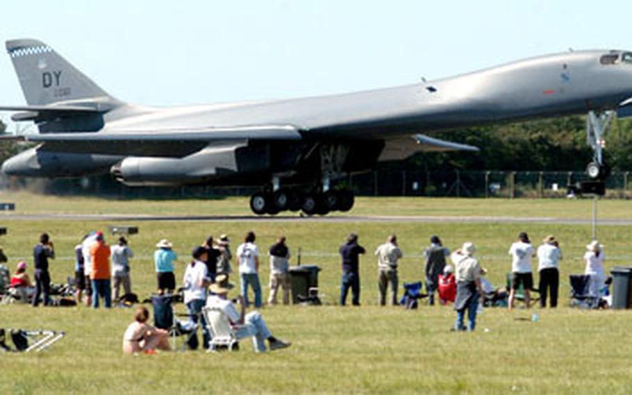 A B-1B Lancer lands in front of spectators gathered for the Royal International Air Tattoo at RAF Fairford. Hundreds of aircraft from around the world took part in the two-day air show, either through performances or static displays.
