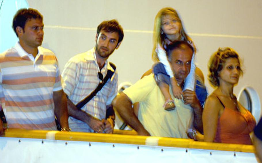 U.S. citizens leave the cruise ship Orient Queen at Larnaca, Cyprus, early Thursday.