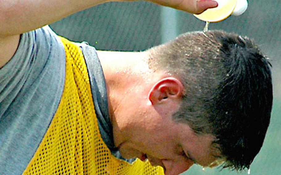 1st Lt. James Neill, Company B, 2nd Military Intelligence Battalion, tries to cool down during an organizational day soccer game in Griesheim, Germany, on Thursday, as temperatures approached 100 degrees.