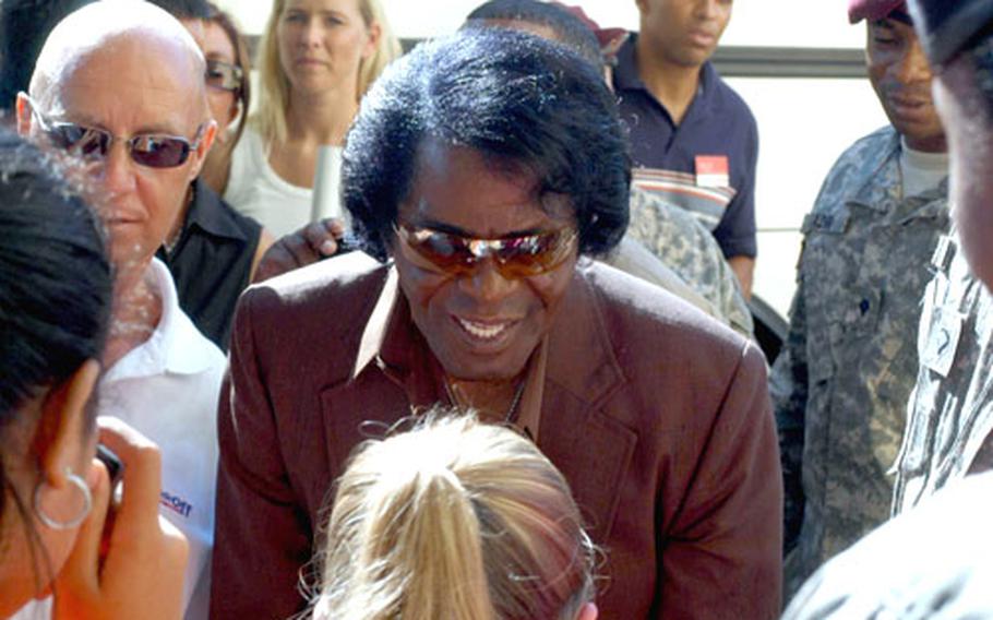 James Brown talks to fans in Vicenza, Italy, on Wednesday.