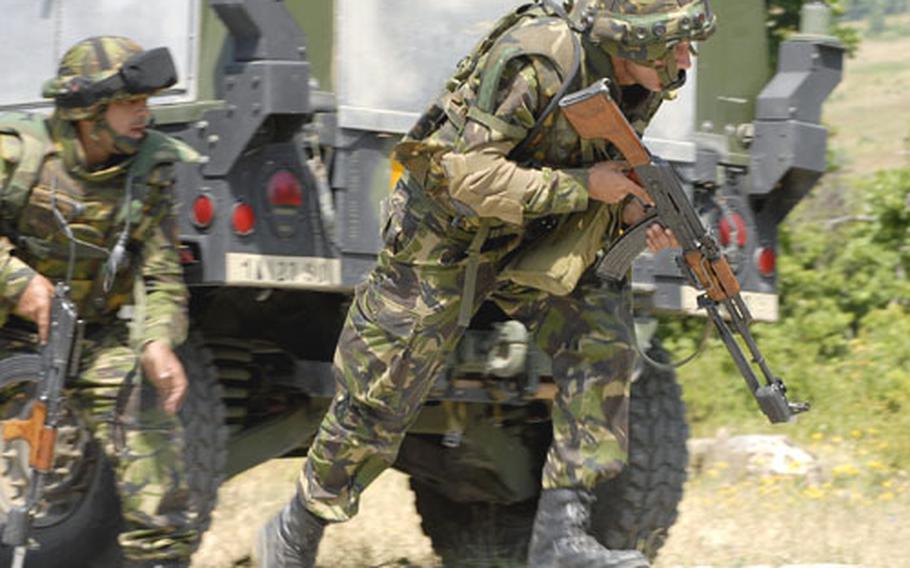 Bulgarian soldiers rush to take on the enemy during a convoy ambush training exercise held at the Novo Selo Training Area, Bulgaria.