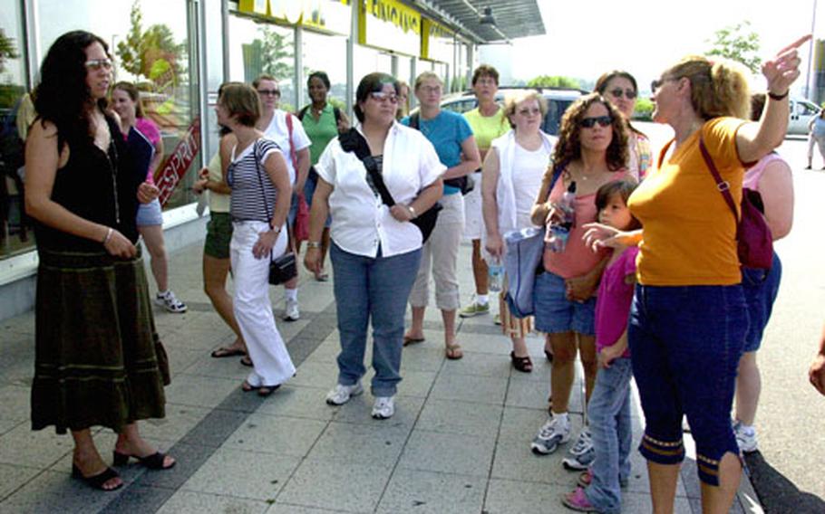 Welcome to Bavaria tutor Manuela Fleming, right, shows 2nd Cavalry (Stryker) Regiment spouses around Kaufland, a large shopping mall in Amberg, Germany, on Friday.