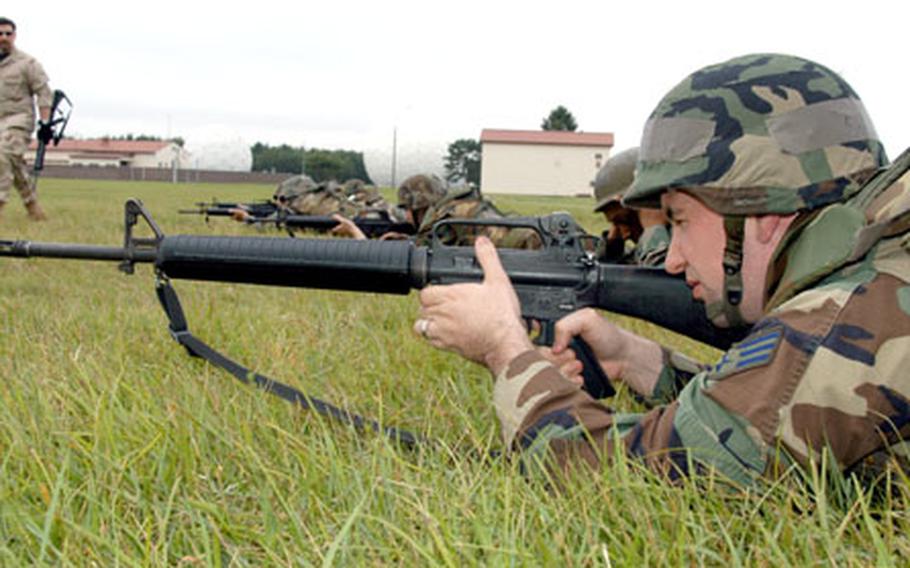 Senior Airman John Walker practices individual movement techniques with an M-16 during expeditionary combat skills training at Misawa Air Base, Japan, last week.
