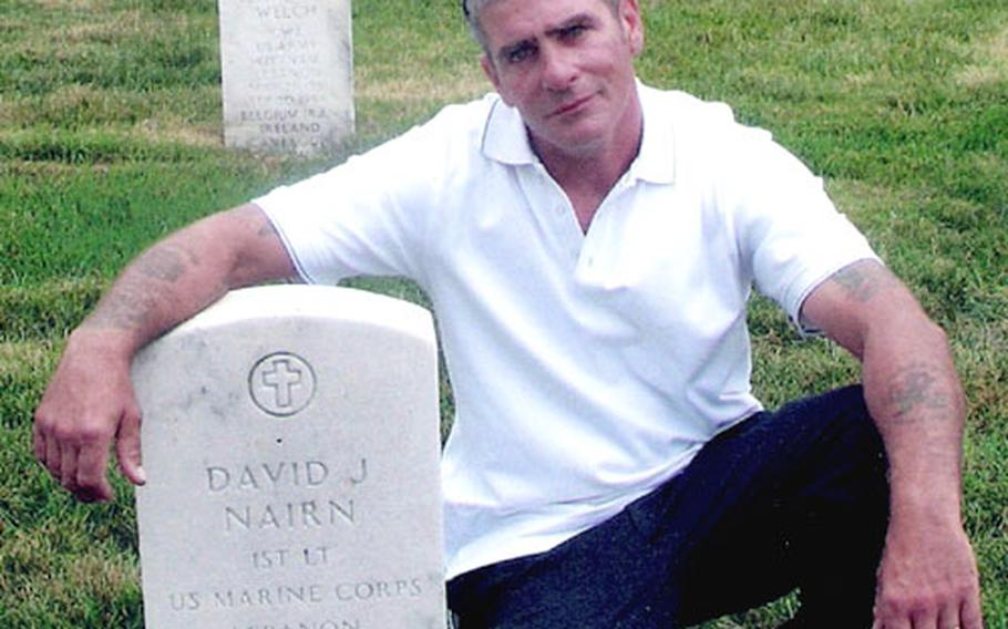 “It was like we were all in state of shock but we didn’t know we were in shock. We just kept going,” said Tim McCoskey, shown here in June at the grave of his friend, David J. Narim, who was killed in the bombing on Oct 23, 1983.