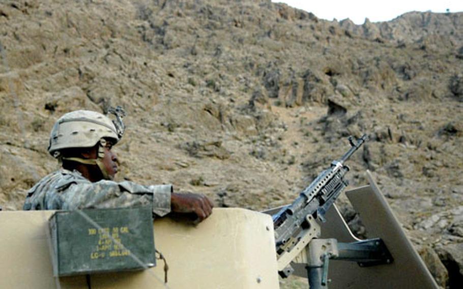 Pfc. Billy McCoy of the 2nd Brigade 4th Infantry mans a Humvee turret as his unit sets up a security perimeter before spending the night in the Chalcor Valley defending a disabled vehicle. Afghan National Army soldiers promised to support the exposed U.S. unit, then backed out of that commitment, then returned with a different set of soldiers and spent the night. U.S. officials said the episode underscores the inconsistency of the ANA.