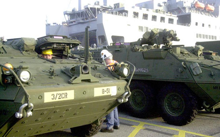 Pfc. Ben Zibutis with the 1st Battalion, 2nd (Stryker) Cavalry Regiment, out of Vilseck, Germany, brings a Stryker vehicle to a stop Monday morning at the port in Bremerhaven, Germany.