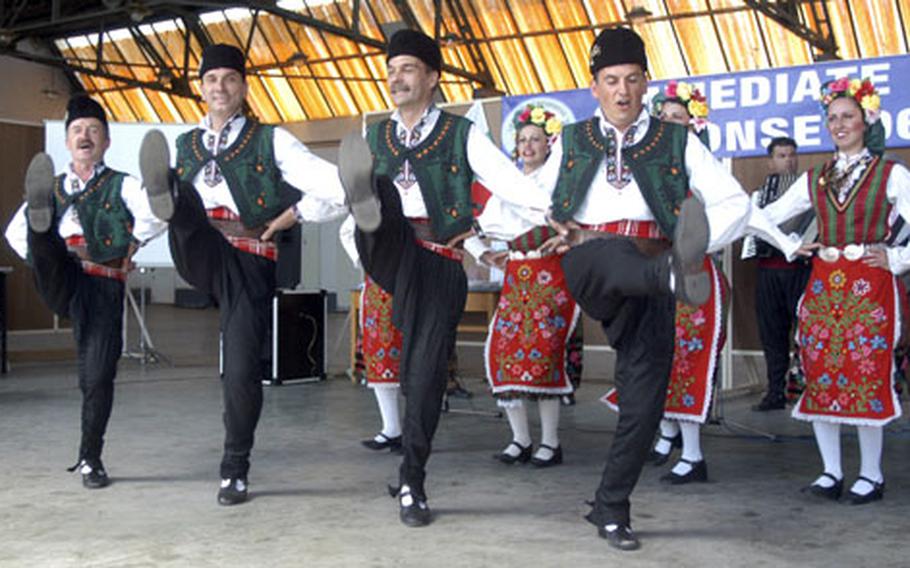Bulgarian dancers kick up their heels during a performance Sunday afternoon at Bezmer air base, Bulgaria. The group was performing at a party to celebrate the conclusion of the exercise Immediate Response 2006 between U.S., Bulgarian and Romanian troops.