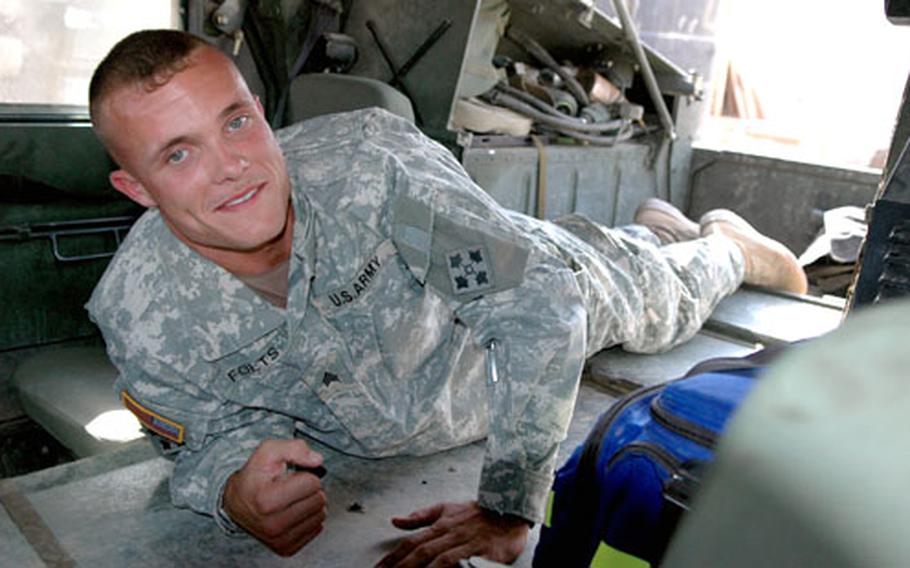Sgt. Justin Folts, 23, stretches out in his modified Humvee. Folts, a medic with 3rd Battalion, 29th Field Artillery Regiment, part of the Fort Carson, Colo.-based 4th Infantry Division, came up with an idea to save lives by making room for wounded patients to lie down inside a Humvee. The back panel of the passenger cabin folds down to accommodate a stretcher.