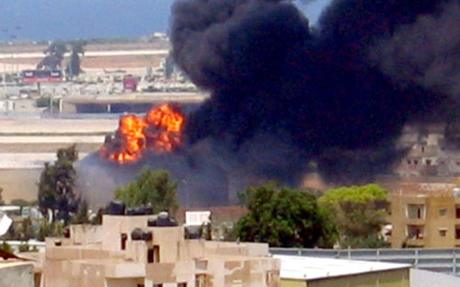 A fire at the Beirut, Lebanon, airport, as seen from the balcony of the building where Air Force Capt. Jennifer Tay was staying when the airport was hit by Israeli bombs last week.