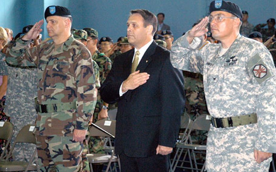 At Camp Walker in Daegu, South Korea, on Thursday, Col. Donald J. Hendrix, left, retires after 28 years in the Army. Davis D. Tindoll Jr., director of the Army’s Installation Management Agency–Korea Region Office, stands next to Hendrix and Army Col. John E. Dumoulin Jr., who assumes command of the Army’s Area IV Support Activity.
