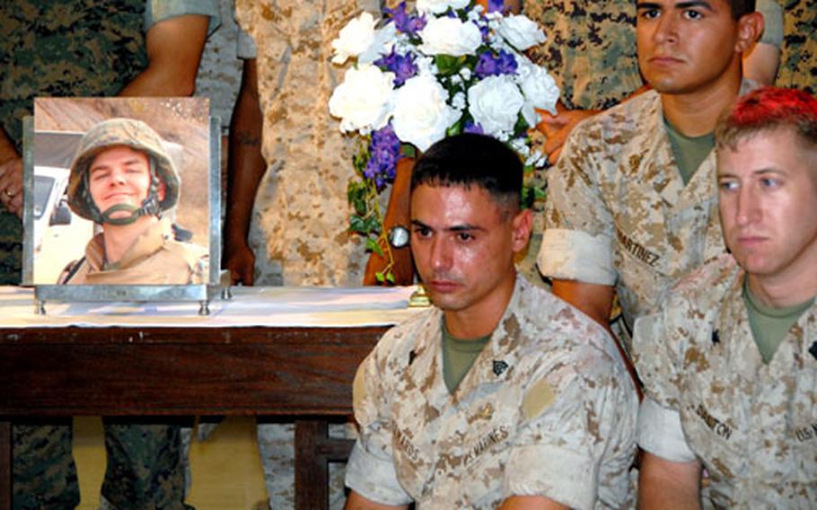 Marines at Camp Hansen on Okinawa hold a memorial service Monday for Sgt. John Phillips, who died after a five-month fight to survive burns suffered in Fallujah, Iraq, in March. During his recovery, Phillips married his girlfriend and was on the mend when infections set in and took his life.