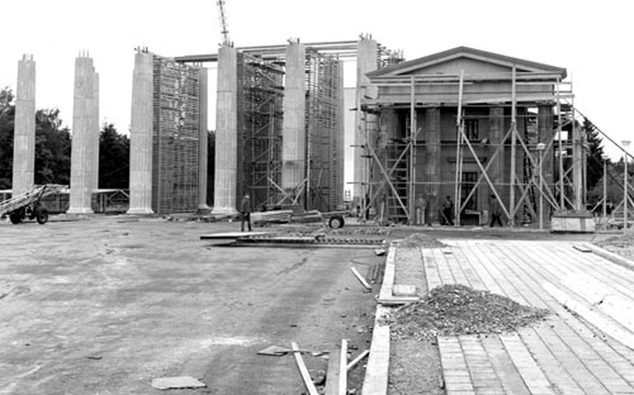 Workers at the Bavarian Film Studios in Munich construct a replica of the Brandenburg Gate for the Billy Wilder film, "One, Two, Three," in July, 1961.