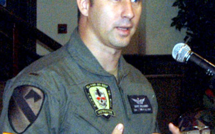 Chief Warrant Officer David Williams, a former OIF prisoner of war, talks about his experiences during a POW/MIA remembrance ceremony at RAF Mildenhall Sept. 12.