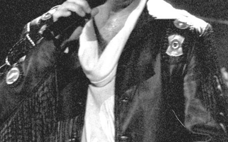 Singer-actor David Hasselhoff performs for a crowd of over 8,000 at the Cologne, Germany, Sporthalle in December, 1991.