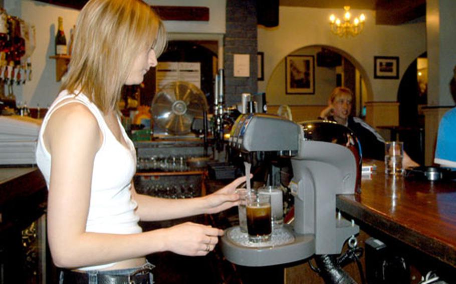 Bartender Donna Bray makes drinks on a recent night at the Temple Bar in Newmarket.
