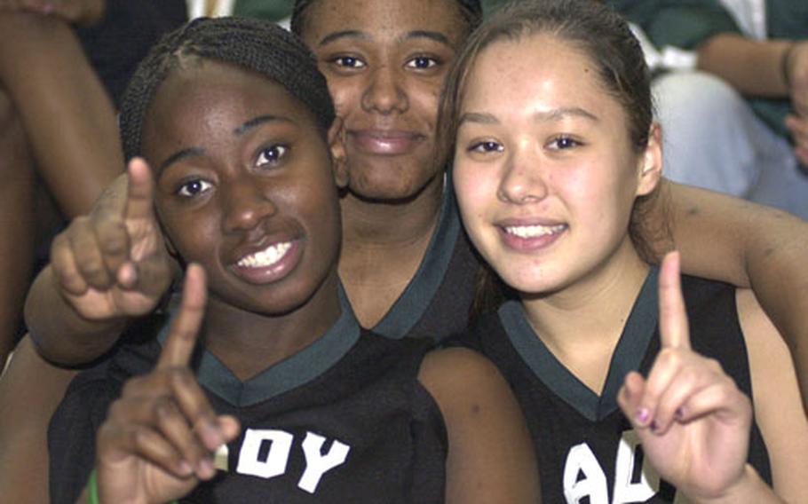 Lynette Grant, left, was killed Friday in an automobile accident near Jacksonville, Ala., where she was a freshman at Jacksonville State. She is pictured above as a high school senior with fellow Taegu American athletes Tamara “Tank” Hancock and Kelli Cox.