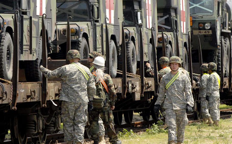 Soldiers from Dexheim, Germany, remove vehicles from rail cars during this year’s Immediate Response exercise in Bulgaria. U.S. Army Europe officials expect planned rotation of forces into Romania to start next year.