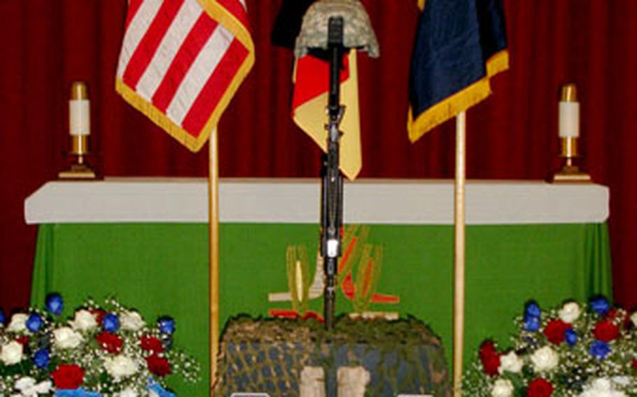 At a memorial ceremony for Pfc. Eric M. Kavanagh, symbols of his service rest at the front of Ledward Chapel at Ledward Barracks in Schweinfurt, Germany, Friday.