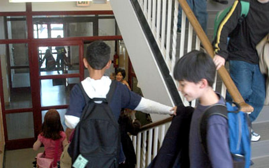 Students go down one of two stairwells at the four-story, 525-student Boeblingen Elementary-Middle School. The school was cited for nine safety violations in a September inspection, and some parents are urging that safety improvements be made.