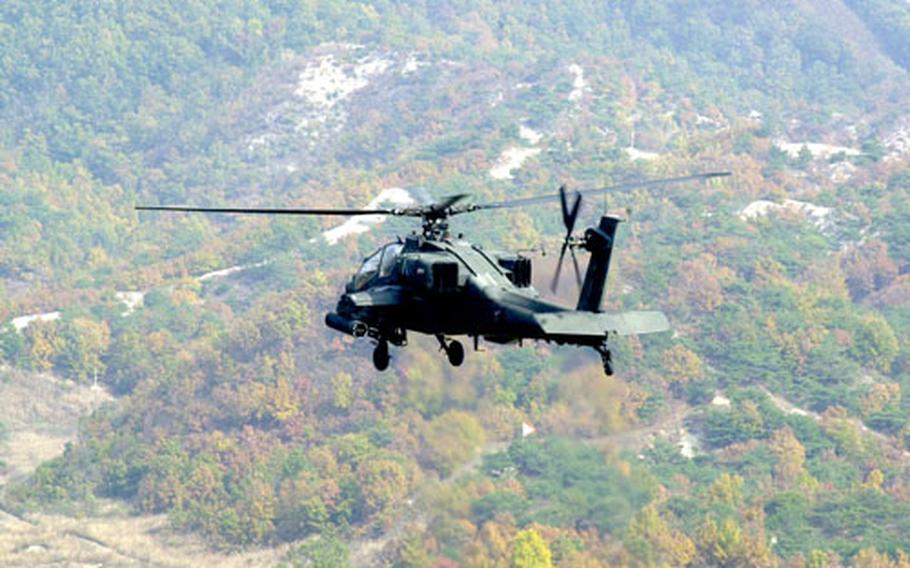 An AH-64 Apache helicopter fires its 30mm guns at Rodriguez Range, South Korea, on Tuesday. The 2nd Combat Infantry Brigade’s 1st Battalion, 2nd Aviation Regiment, is to complete annual qualifications for 25 crews and 18 Apache helicopters this week.
