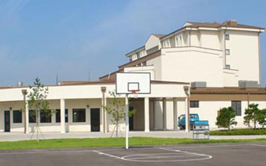 Officials plan a Nov. 9 grand opening for this newly built twin barracks-dining hall complex in Camp Humphreys’ Zoeckler Station section. The Army says the $27 million complex is the biggest of its kind in South Korea. The dining hall is in the foreground and one of the two barracks is behind it to the right.
