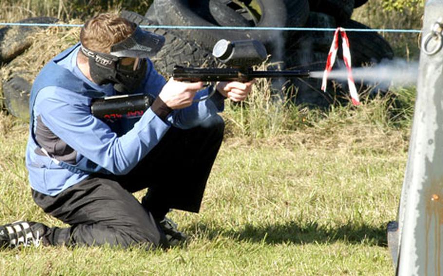 Airman 1st Class Glenn Cook, representing RAF Croughton, fires on an opponent during the USAFE paintball tournament.