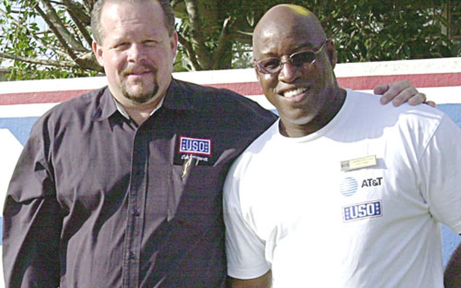 Retired airman Kevine Meade and retired Marine Gardner Williams have status-of-forces-agreement status on Okinawa through their employment with the United Service Organization.